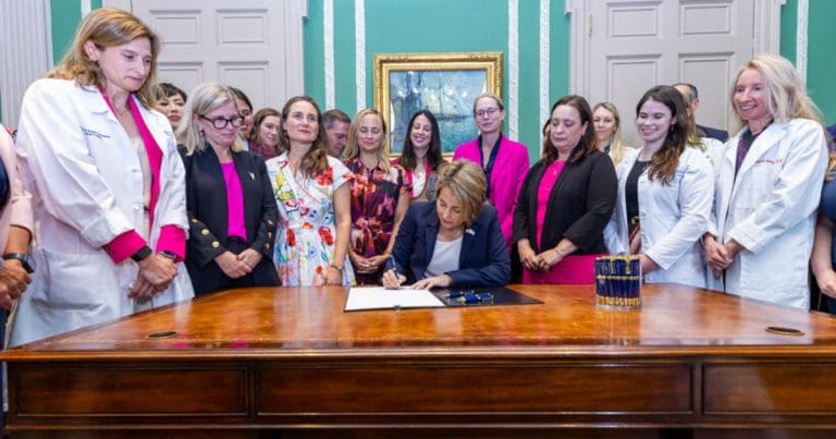 Governor Maura Healey signing Massachusetts abortion law expanding reproductive access