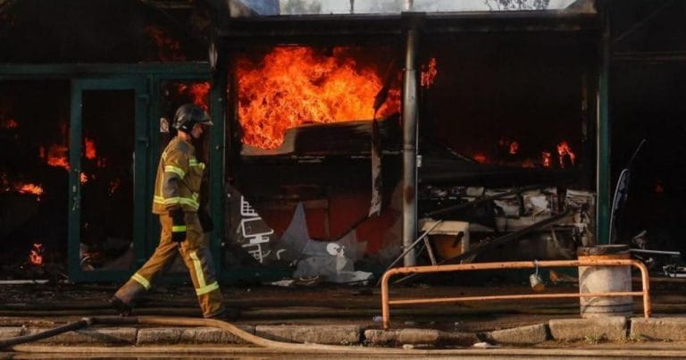 Emergency responders at the site of the Kyiv market hit during the Russian drone strikes.