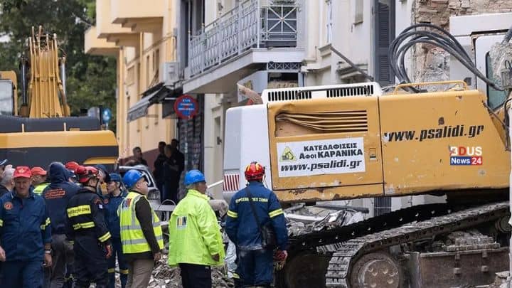 Rescue workers searching through the rubble after a building explosion near Athens Acropolis