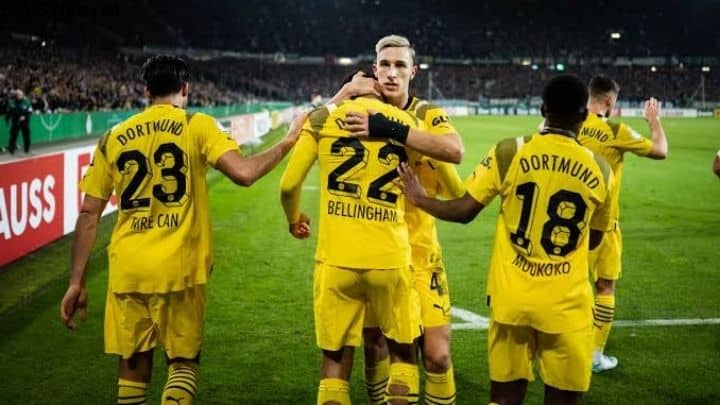 Borussia Dortmund players celebrating a dominant victory during their DFB-Pokal fixture.