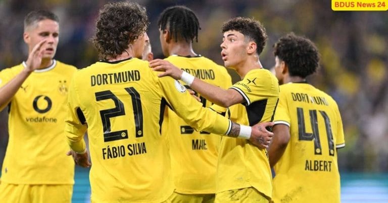 Borussia Dortmund players celebrating a dominant victory during their DFB-Pokal fixture.