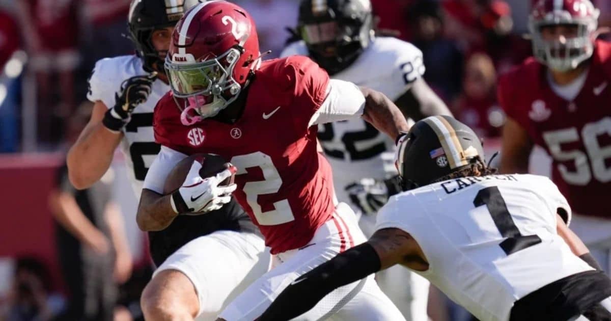 East Carolina vs Alabama college football game action with players in red and white jerseys on the field