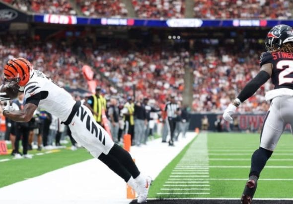 Cincinnati Bengals player making a catch in an NFL game