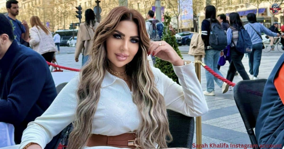 Egyptian TV presenter Sarah Khalifa sitting outdoors at a café in a white outfit following her legal developments