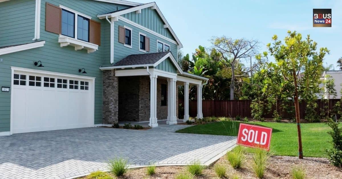 Modern residential house with a sold sign