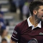 Novak Djokovic reacting on the court during his tennis match against Alexander Zverev.