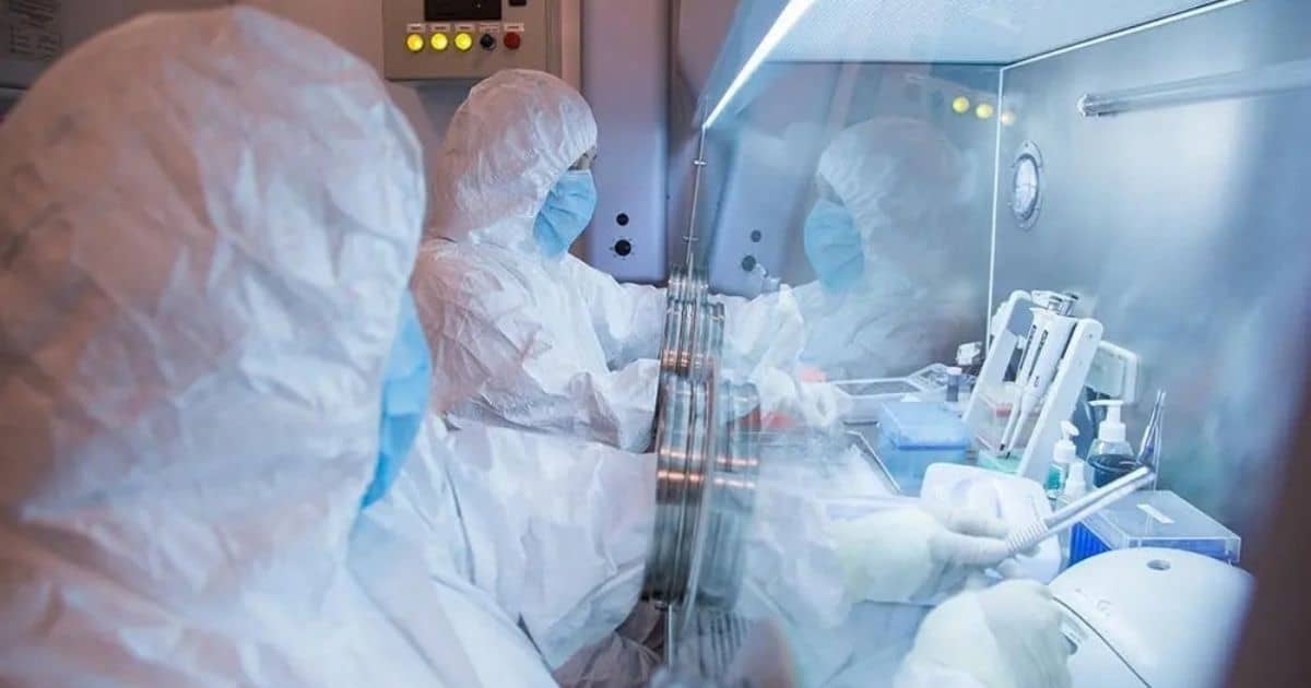 Researchers in protective suits working in a specialized laboratory environment, relating to the Siberian plague institute safety investigation.