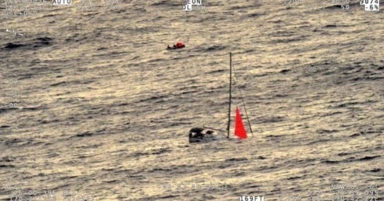 A sinking yacht and life raft in the South Pacific after a sperm whale collision